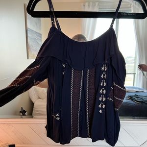 Off the shoulder, quarter sleeve country shirt.